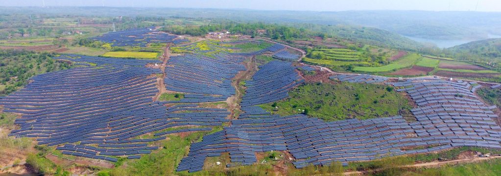 This aerial photo shows solar photovoltaic modules on a hillside in a village in Chuzhou, in eastern China's Anhui province on April 13, 2017.