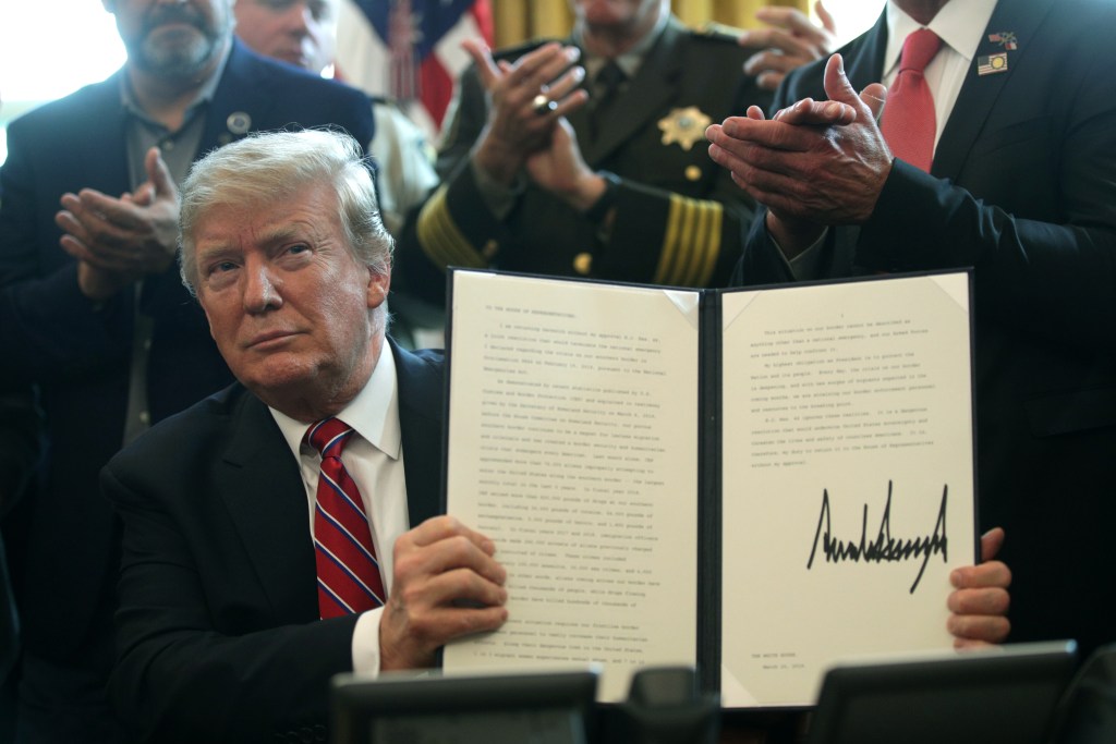 President Donald Trump holds an executive veto, his first as president, in the Oval Office of the White House March 15, 2019 in Washington, DC.