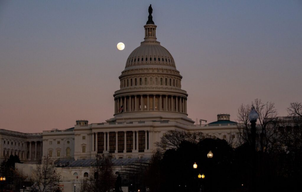US Capitol building at sunset with moon