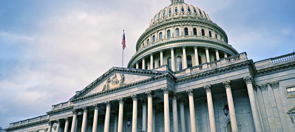 Shot of the United States Capitol in front of a cloudy sky
