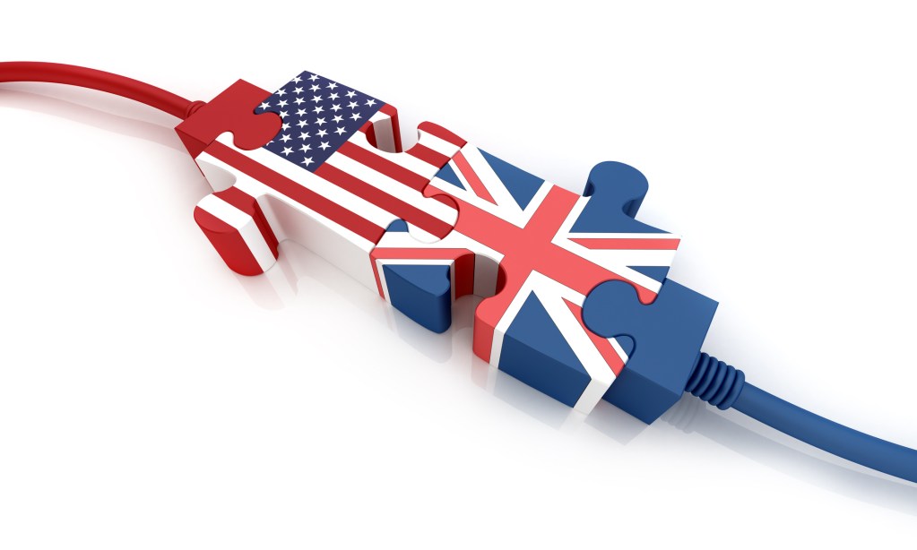 Puzzle Pieces with the American and United Kingdom flags and wires