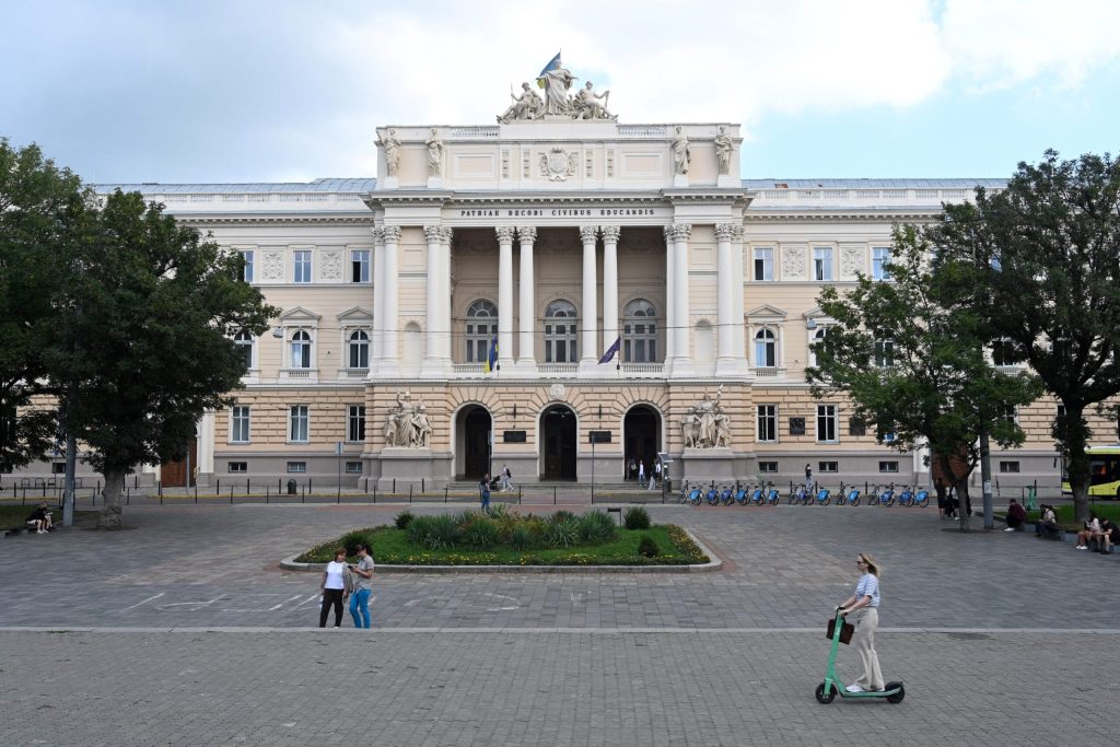 Wide-angle shot of a university building with plaza in front