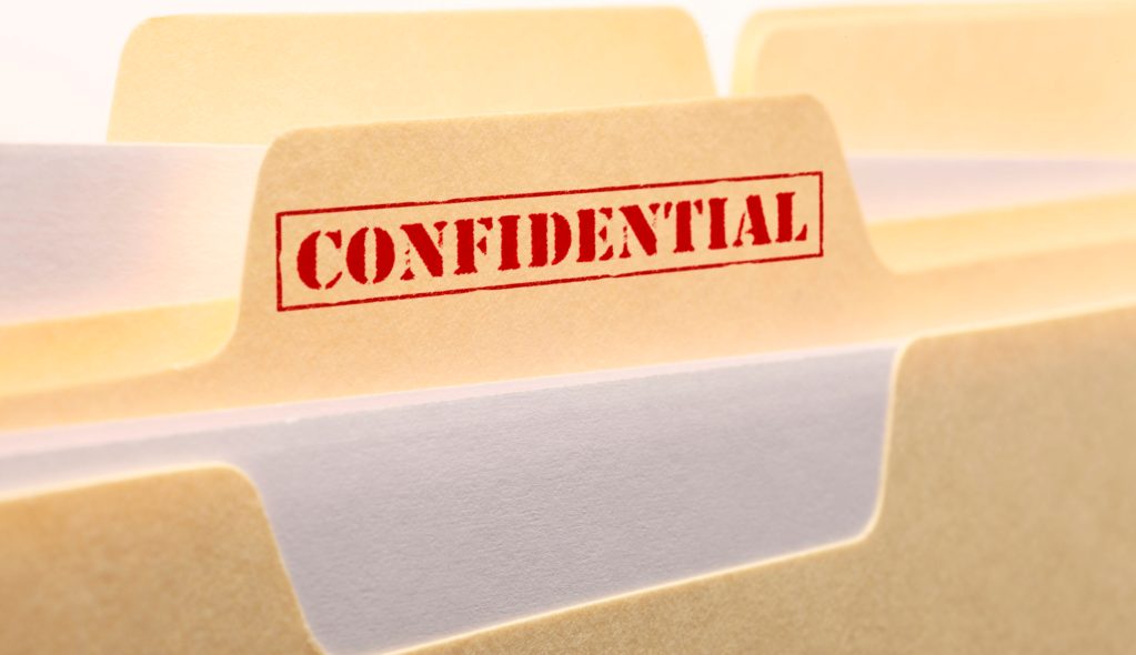 A close up of the tab from a confidential file folder.