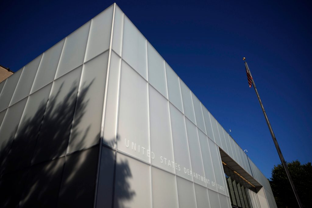 The corner of the Harry S. Truman Federal Building's white facade with a shadow in the lower left corner.
