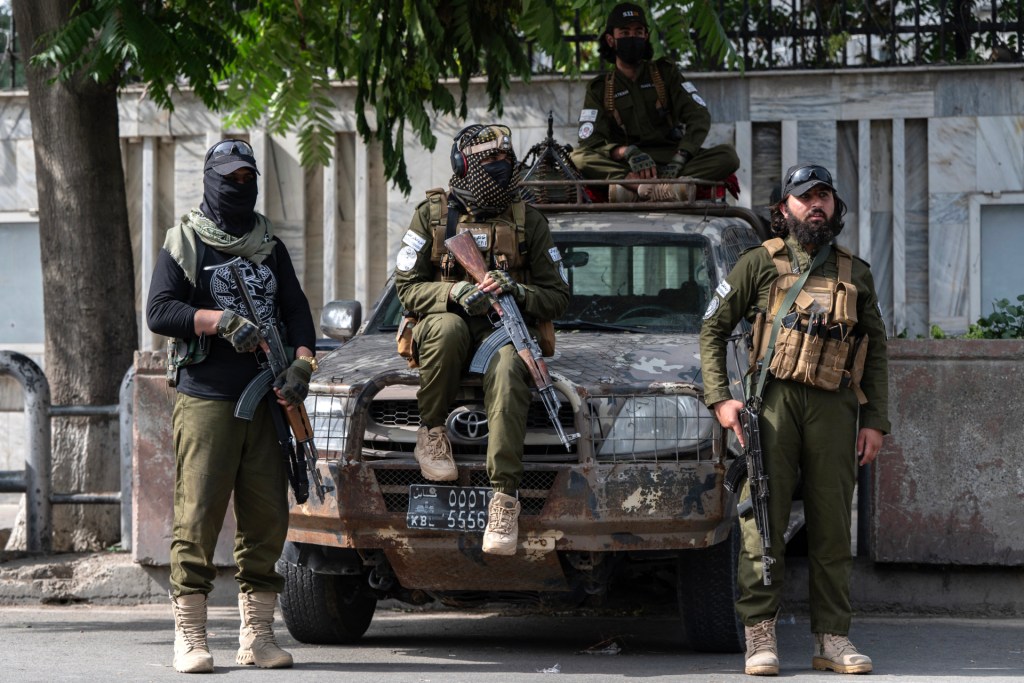 Taliban security personnel keep watch after the Eid al-Adha prayers at a checkpoint in Kabul on June 7, 2025. (Photo by WAKIL KOHSAR/AFP via Getty Images)