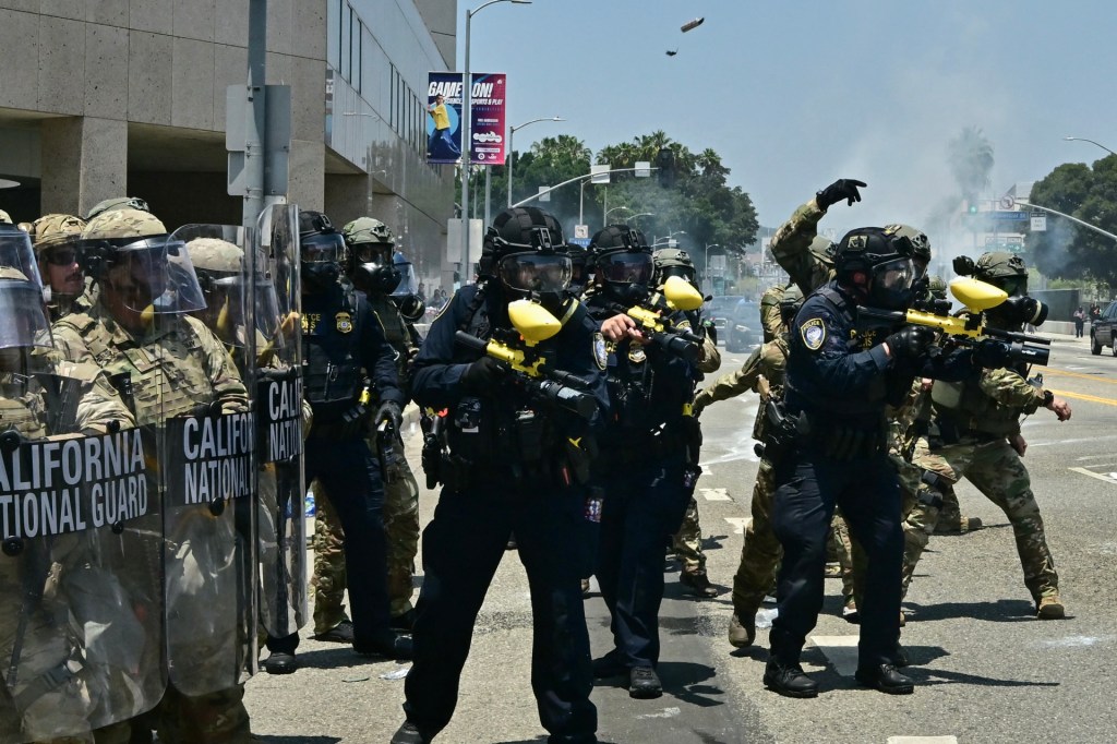 National Guard soldiers and US Department of Homeland Security (DHS) Police officers clash with demonstrators outside the Metropolitan Detention Center, MDC, in downtown Los Angeles, California on June 8, 2025. (Photo by FREDERIC J. BROWN/AFP via Getty Images)