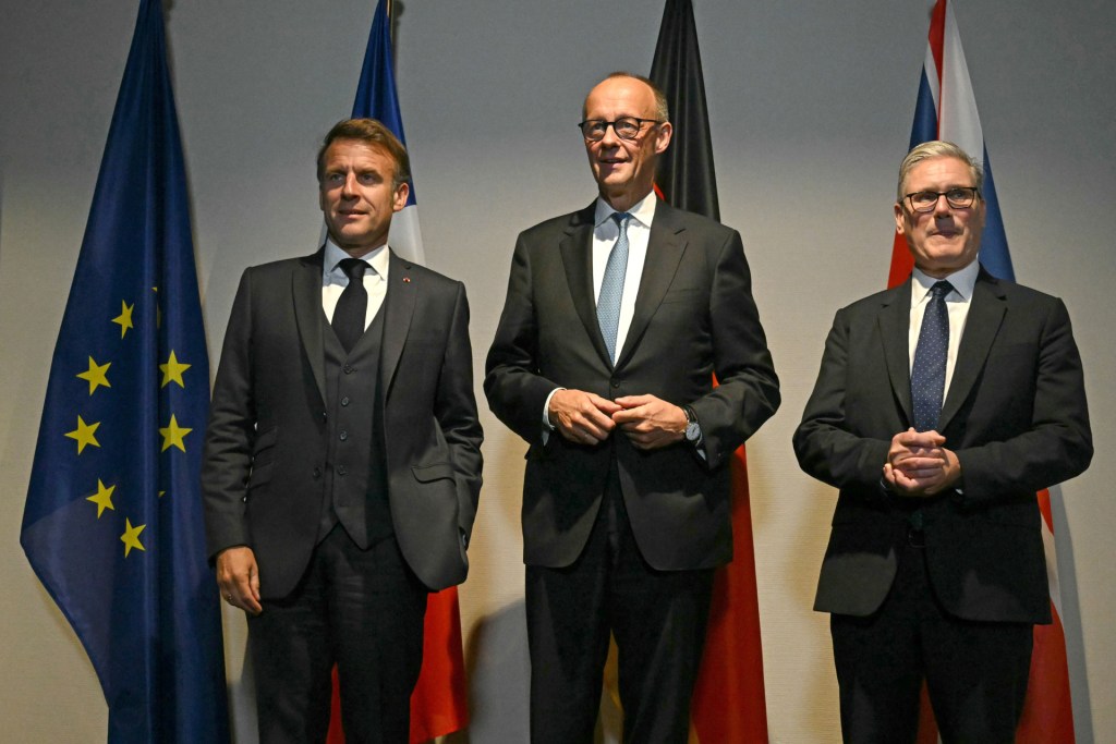 (L-R) French President Emmanuel Macron, Germany's Chancellor Friedrich Merz and British Prime Minister Keir Starmer pose for the media at a hotel prior to an E3 meeting on the sidelines of the 2025 NATO summit on June 24, 2025 in The Hague, Netherlands. (Photo by Ben Stansall - WPA Pool/Getty Images)