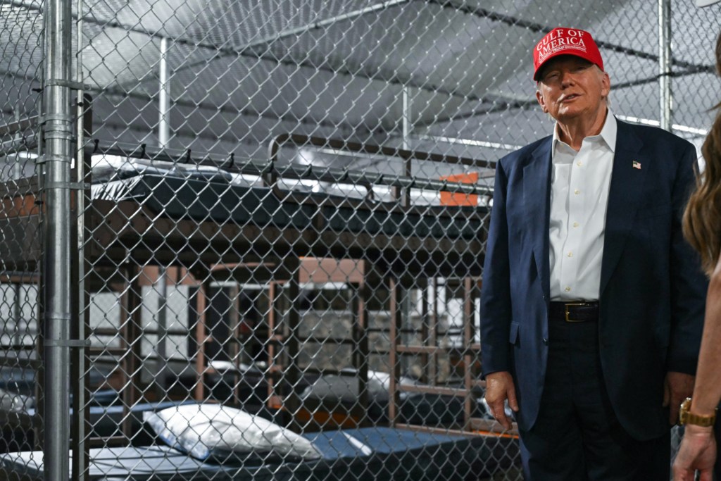 US President President Donald Trump tours a migrant detention center