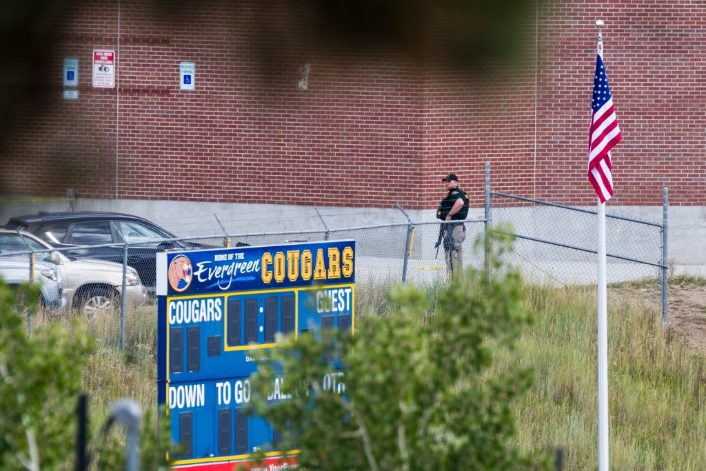 A police officer responds to a shooting at Evergreen High School on September 10, 2025 in Evergreen, Colorado. At least three students, including the suspected shooter, were injured in the attack. (Photo by Michael Ciaglo/Getty Images)