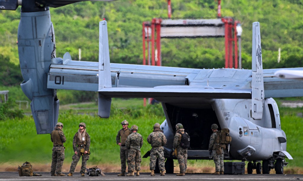 US Marines unload from an Osprey V-22 aircraft at Jose Aponte de la Torre Airport