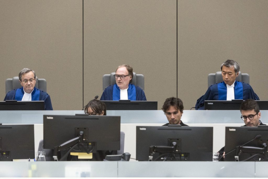 (From L) Judge Marc Perrin de Brichambaut of France, Presiding judge Cuno Tarfusser of Italy and judge Chang-ho Chung of Korea run the International Criminal Court (ICC) in The Hague, on July 6, 2017.